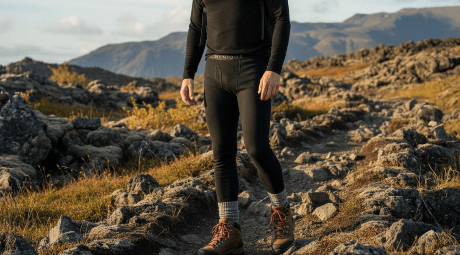 a man wearing black merino menique pants