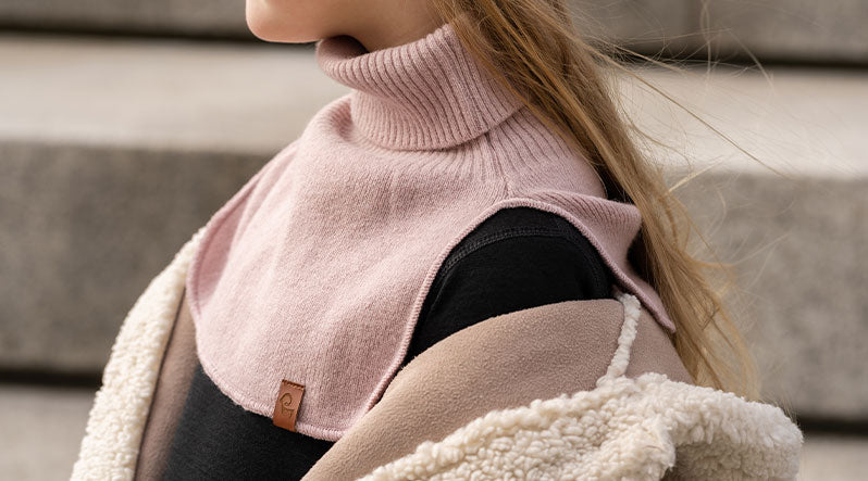 Girl standing outdoors and wearing dusty pink neck turtle dickie