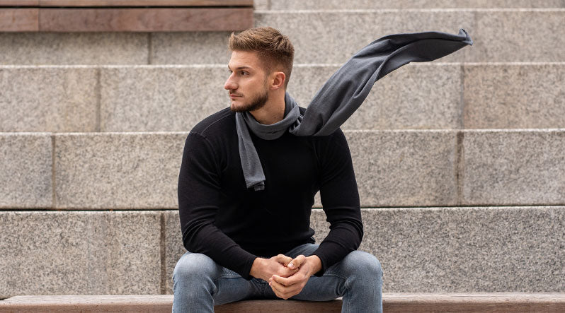 Man outdoors with a merino wool scarf
