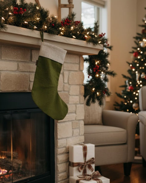 Cozy living room with a fireplace, stockings, and Christmas tree.