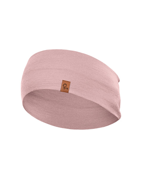 A light dusty pink, finely knitted headband displayed in a three-dimensional, rounded shape against a pure white background. A small, square brown leather logo patch is centered near the bottom front edge.