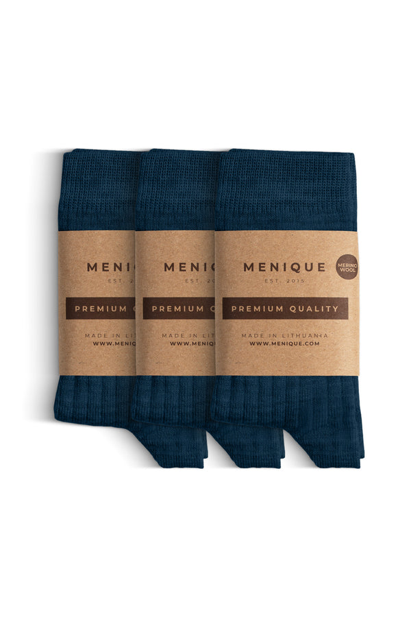 A 3-pack of kids’ dark blue ribbed merino wool socks with “Menique Premium Quality” labels.