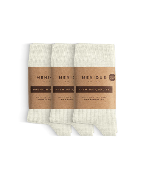 A 3-pack of kids’ natural merino wool socks with “Menique Premium Quality” labels.