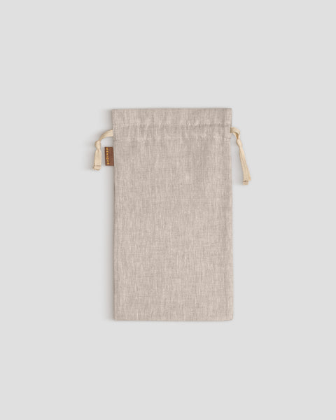 Beige drawstring pouch on a light gray background