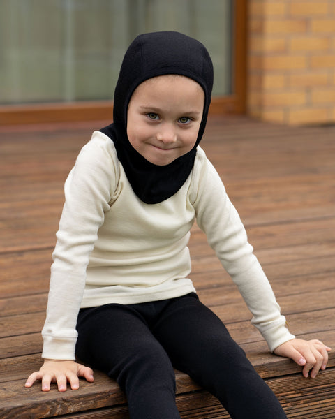 Child wearing black merino wool balaclava 