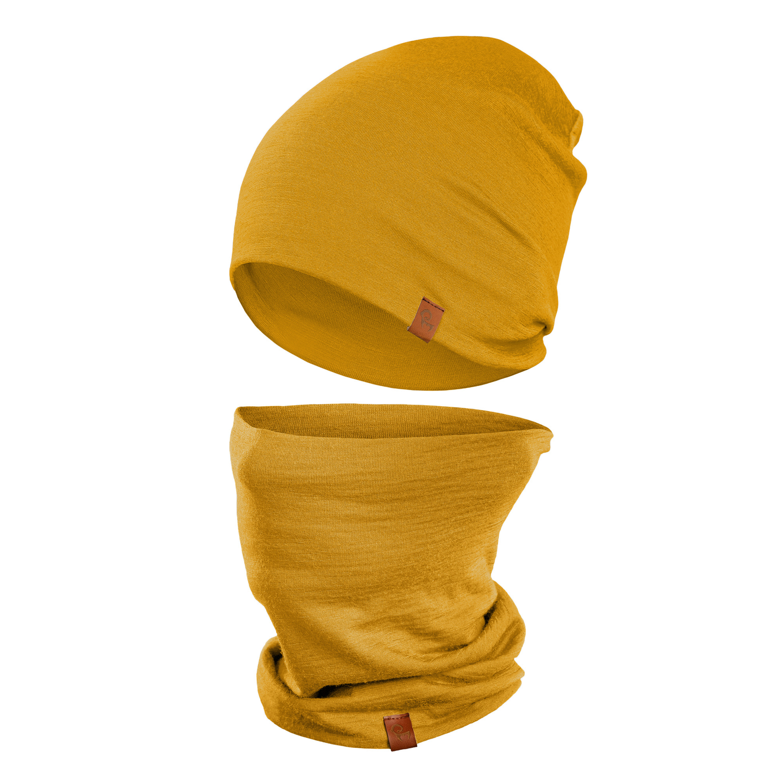 A person with light eyes is wearing a spicy yellow menique beanie that is pulled down to cover part of their forehead and a matching neck gaiter that is pulled up to cover their mouth and nose. They are wearing a dark long-sleeved shirt, and the blurred background suggests an outdoor setting with trees and foliage in muted tones.