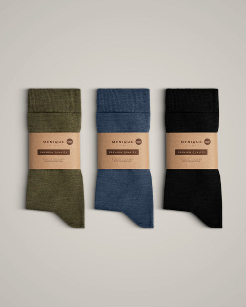 The menique men&#39;s merino wool crew socks in all available colors, with packaging.