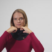 Woman puts on Merino wool face mask balaclava