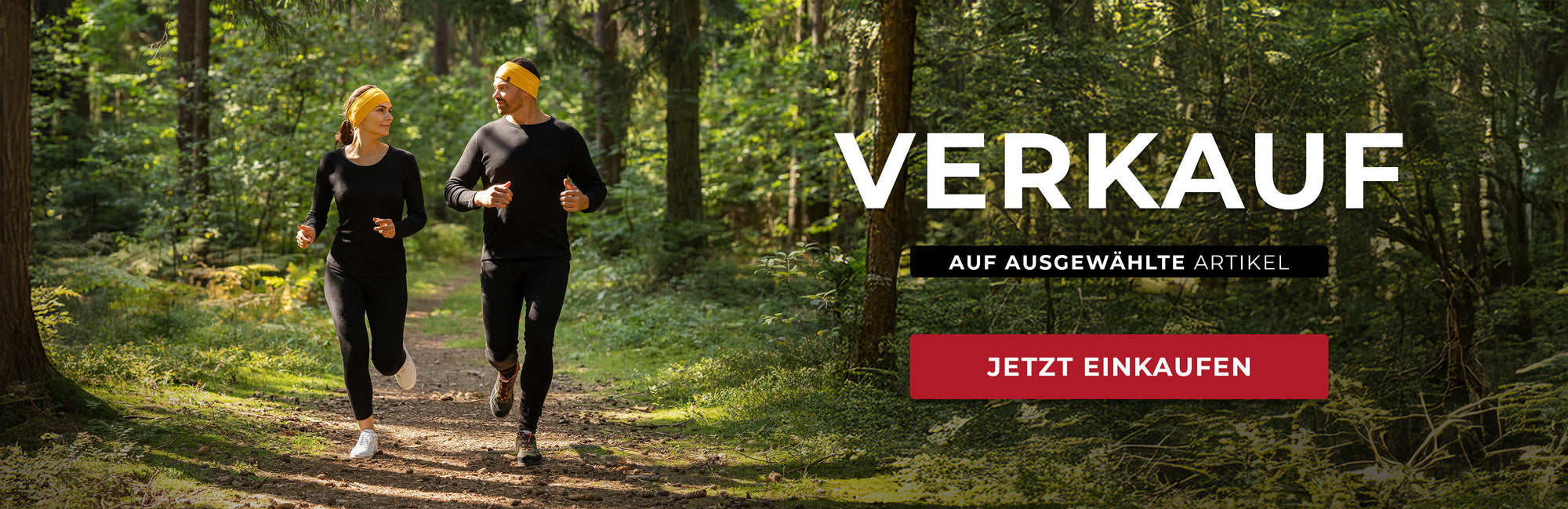 An advertisement featuring two people running in a forest, with the text "VERKAUF AUF AUSGEWÄHLTE ARTIKEL JETZT EINKAUFEN" displayed.

