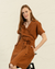 a woman wearing the menique almond brown dress ELIANA.