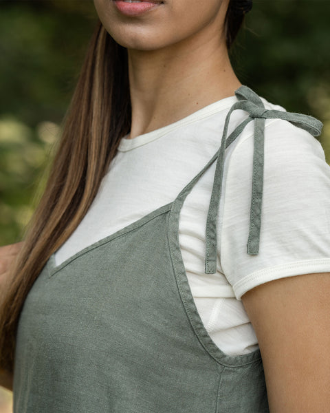Woman showing her slip dress shoulder straps
